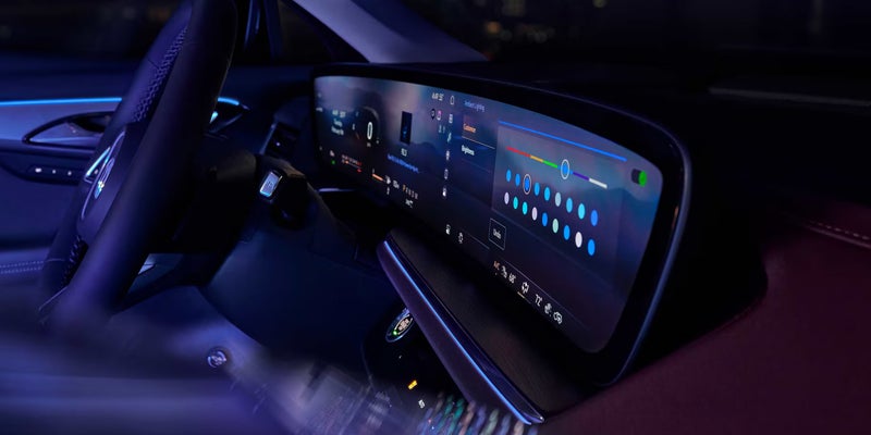 Buick Envision interior view with digital display and steering wheel