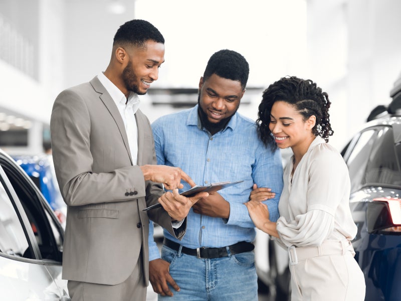 Family working with sales person