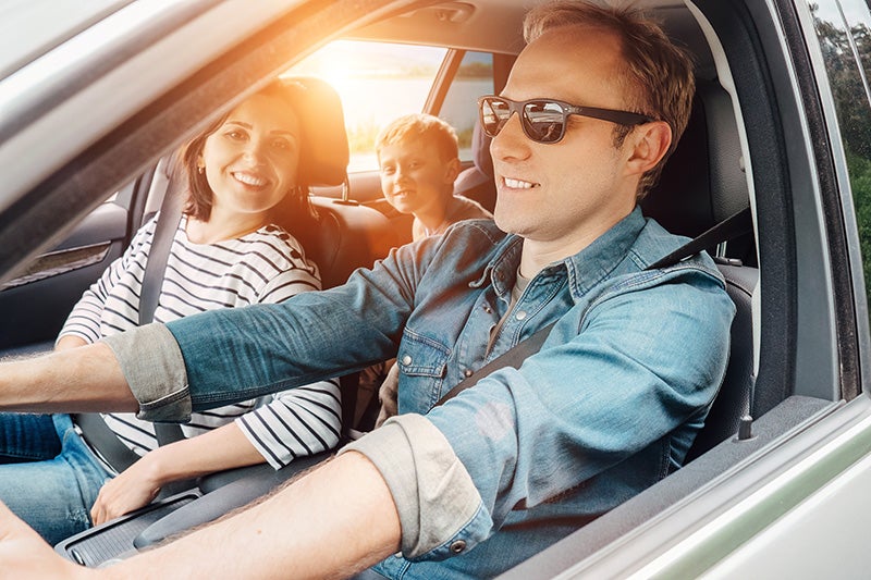 Family enjoying car drive